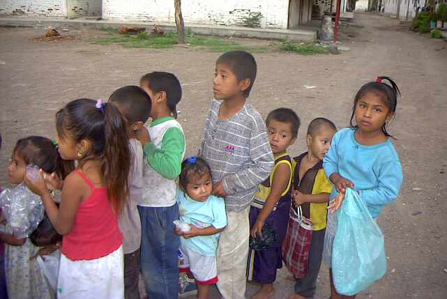 childrenwaitinginlineforbread.jpg